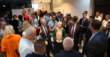 Graduates from the Turkish universities and the Presidency for Turks Abroad and Related Communities (YTB) officials gather at an event in Sarajevo, Bosnia-Herzegovina, Sept. 5, 2024. (AA Photo)