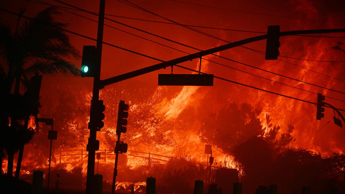 Flames overtake the intersection of Temescal Canyon and the Pacific Coast Highway in Pacific Palisades, California, U.S., Jan. 7, 2025. (AFP Photo)