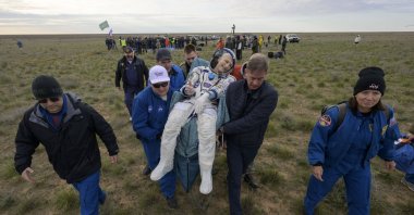 NASA astronaut Don Pettit is carried to a medical tent shortly after he, and Roscosmos cosmonauts Alexey Ovchinin and Ivan Vagner landed in their space capsule near the town of Zhezkazgan, Kazakhstan, April 20, 2025. (EPA Photo)