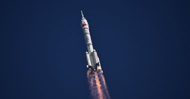 A Long March-2F carrier rocket, carrying the Shenzhou-20 spacecraft and a crew of three astronauts, lifts off from the Jiuquan Satellite Launch Centre in the Gobi desert, in northwest China, April 24, 2025. (AFP Photo)
