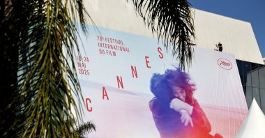 Workers set up the official poster of the 78th annual Cannes Film Festival on the Palais des Festivals facade, Cannes, France, May 11, 2025. (EPA Photo)