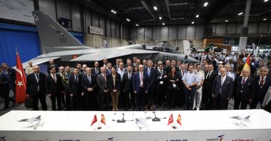 Officials from Turkish Aerospace Industries (TAI), the Spanish Defense Ministry and Airbus pose for a photo after signing a memorandum of understanding in Madrid, Spain, May 14, 2025. (DHA Photo)