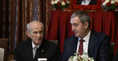 Peoples’ Equality and Democracy Party (DEM Party) co-Chair Tuncer Bakırhan (R) chats with Nationalist Movement Party (MHP) leader Devlet Bahçeli (L) during a commemoration ceremony for late DEM Party lawmaker Sırrı Süreyya Önder, Ankara, Türkiye, May 7, 2025. (AA Photo)