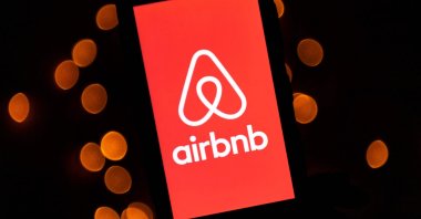 This illustration picture shows the logo of the online lodging service Airbnb displayed on a smartphone in Paris, France, Nov. 22, 2019. (AFP Photo)