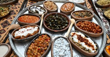 A table showcasing a variety of traditional Turkish dishes for Turkish Cuisine Week. (IHA Photo)