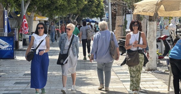 Tourists are photographed walking close to the Port of Marmaris in Bodrum, Muğla, southwestern Türkiye, May 2, 2025. (AA Photo)