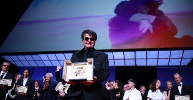 Iranian filmmaker Jafar Panahi onstage after winning the Palme d&#039;Or for &#039;Un simple accident&#039; (It Was Just an Accident) during the closing and awards ceremony of the 78th annual Cannes Film Festival, Cannes, France, May 24, 2025. (EPA Photo)
