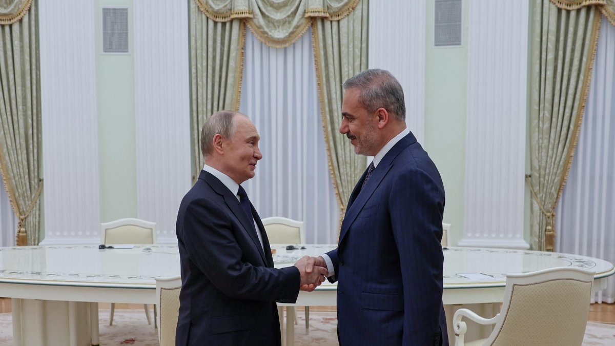 Russian President Vladimir Putin (L) meets with Foreign Minister Hakan Fidan at the Kremlin, Moscow, Russia, May 26, 2025. (Turkish Foreign Ministry Handout via AFP Photo)