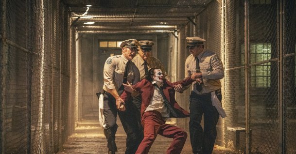 Joaquin Phoenix (foreground C) and Brendan Gleeson (background C) in a scene from &quot;Joker: Folie a Deux.&quot; (AP Photo)