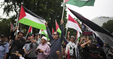 Indonesians wave Palestinian flags during the annual Al-Quds Day rally outside the U.S. embassy in Jakarta, Indonesia, March 28, 2025. (AP Photo)