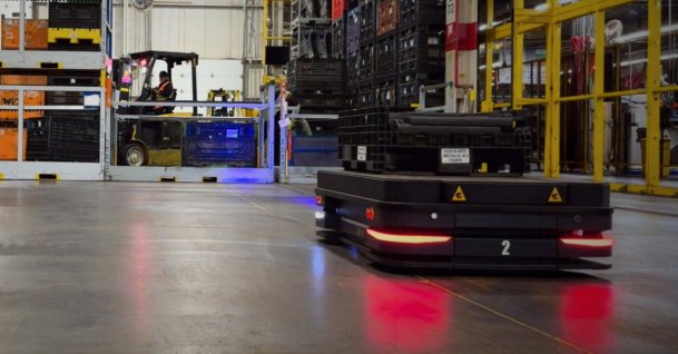 An autonomous mobile robot is seen at a factory. (Courtesy of Milvus Robotics)