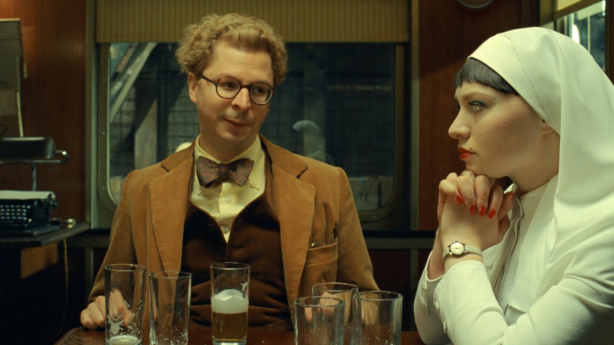 Michael Cera (L) and Mia Threapleton in a scene from &quot;The Phoenician Scheme.&quot; (Focus Features via AP Photo)