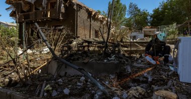 An emergency service member works at the site where Russian drones damaged several private houses, amid Russia&#039;s attack on Ukraine, Zaporizhzhia, Ukraine, June 1, 2025. (Reuters Photo)