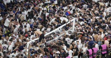 Fans of PSG invade the pitch after the Champions League final match between Paris Saint-Germain and Inter Milan at the Allianz Arena, Munich, Germany, May 31, 2025. (AP Photo)
