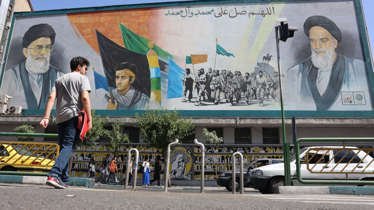 Iranians walk past portraits of Ayatollah Ali Khamenei (L) and late Iranian supreme leader Ayatollah Ruhollah Khomeini in Tehran, Iran, June 1, 2025. (EPA Photo)